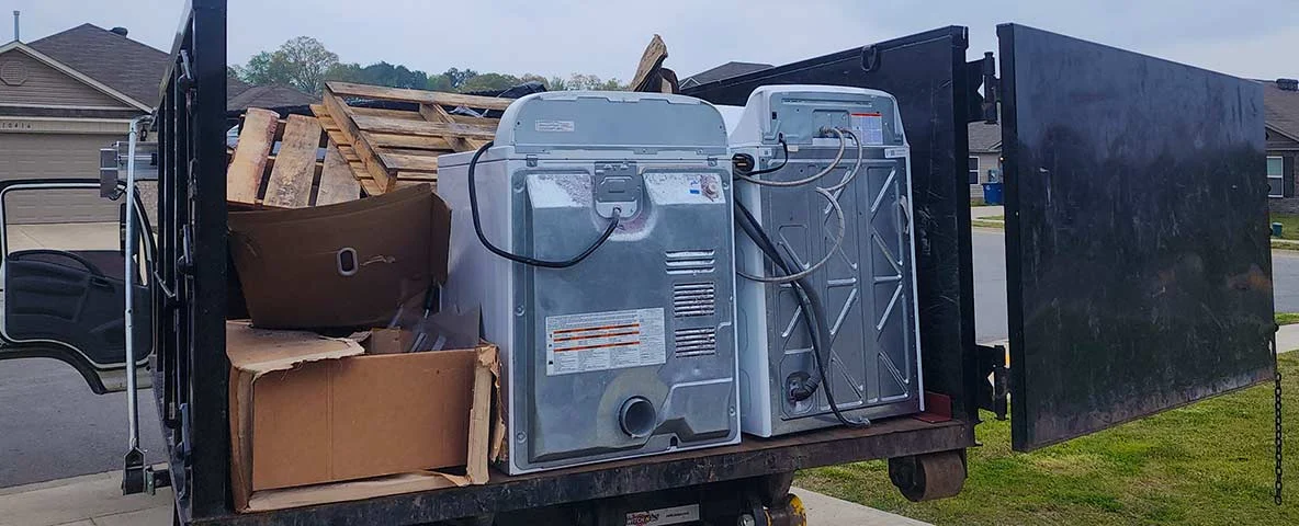 Appliances on truck to be removed from residence