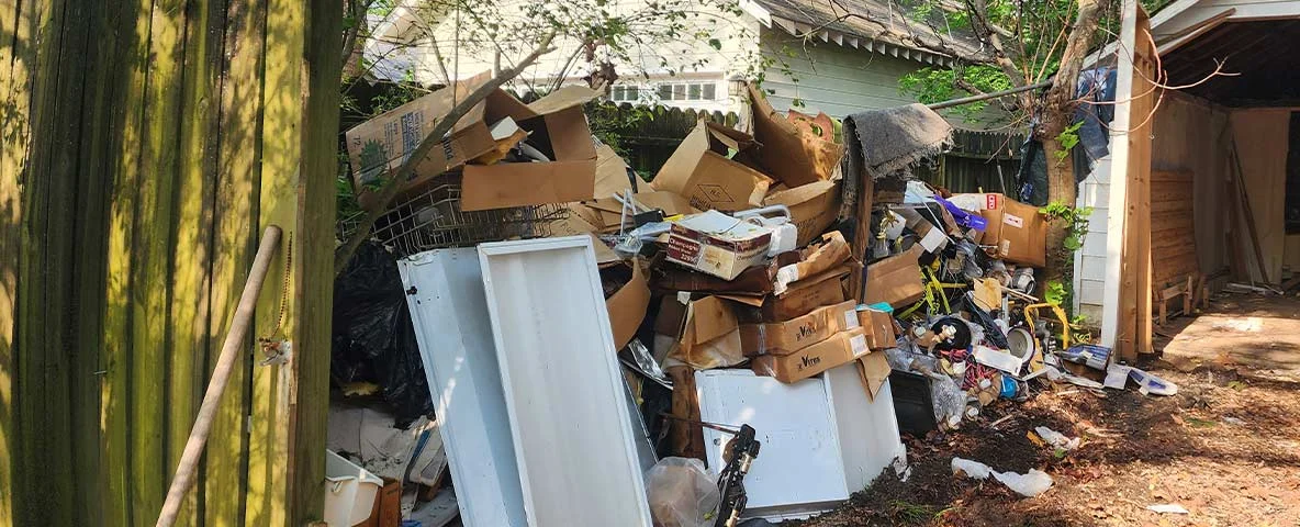 Pile of miscellaneous junk outside of shed