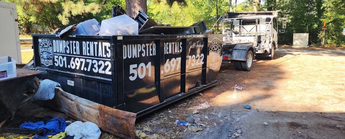 Dumpster being picked up after home cleanup